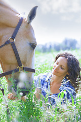 Image showing Woman and horse together at paddock