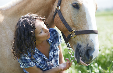 Image showing Woman and horse together at paddock