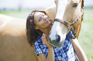 Image showing Woman and horse together at paddock