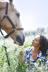 Image showing Woman and horse together at paddock