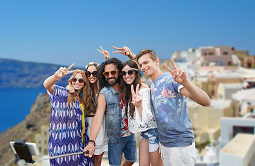 Image showing hippie friends with smartphone on selfie stick