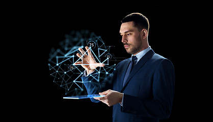 Image showing businessman with tablet pc and low poly projection