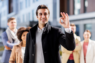 Image showing international business team showing ok hand sign