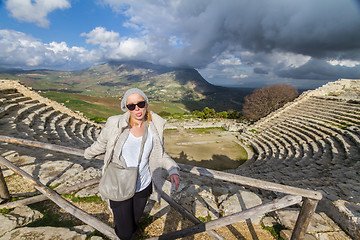 Image showing Tourist taking photo in front of greek theater of Segesta, Sicily, Italy