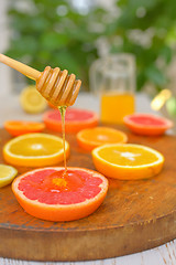 Image showing Grapefruit, clementine, orange and honey