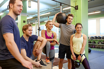 Image showing group of friends with sports equipment in gym