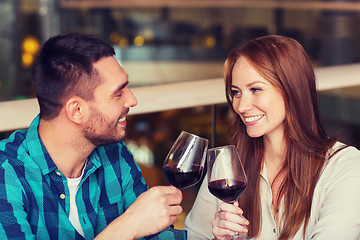 Image showing happy couple dining and drink wine at restaurant