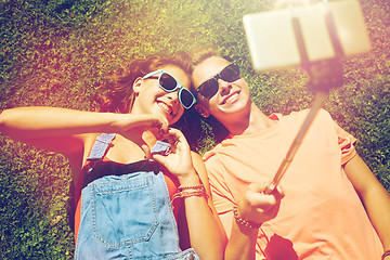 Image showing happy couple taking selfie on smartphone at summer