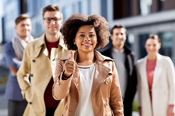 Image showing international business team showing thumbs up