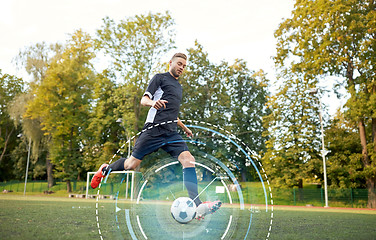Image showing soccer player playing with ball on football field