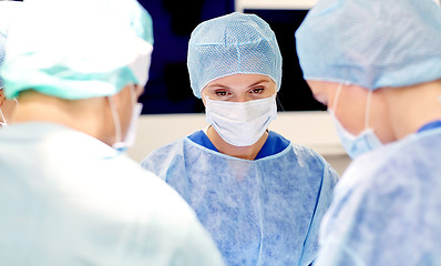 Image showing group of surgeons in operating room at hospital