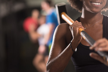 Image showing black woman after workout with hammer