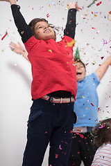 Image showing kids  blowing confetti