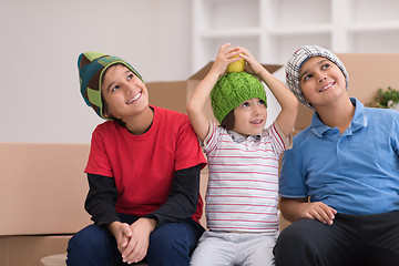 Image showing boys with cardboard boxes around them