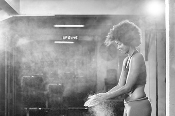 Image showing black woman preparing for climbing workout