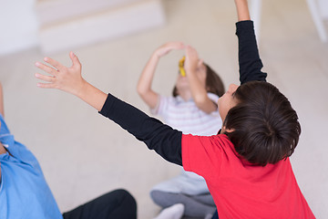 Image showing young boys having fun on the floor