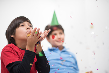 Image showing kids  blowing confetti