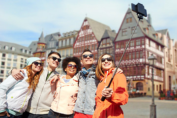 Image showing friends taking photo by selfie stick in frankfurt