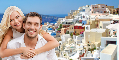 Image showing happy couple hugging over santorini island