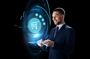 Image showing businessman with tablet pc and shopping cart icon