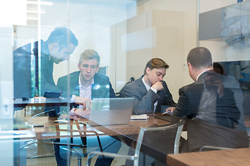 Image showing Business people sitting and brainstorming at corporate meeting.