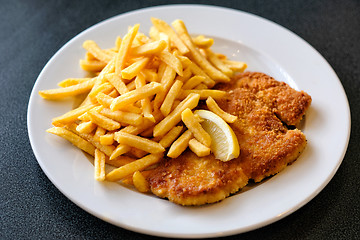 Image showing Wiener Schnitzel with fried potatoes