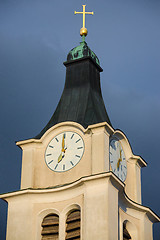 Image showing Bell tower with antique clock and golden cross