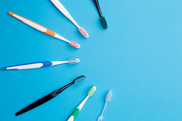 Image showing Multicolored toothbrushes , place for inscription