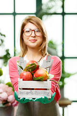 Image showing Happy model. Focused on apples