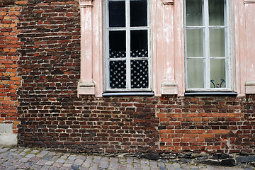 Image showing brick wall and american flag in the window