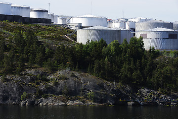 Image showing tank farm on a rocky shore