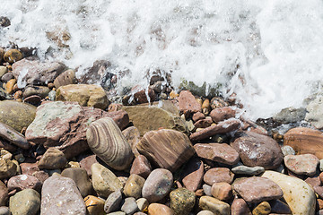 Image showing Wet stones with foaming water