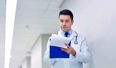 Image showing doctor with clipboard at hospital corridor