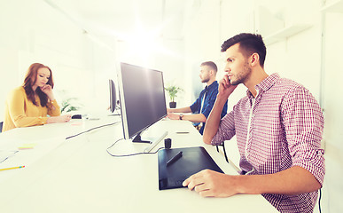 Image showing man or designer with computer and tablet at office