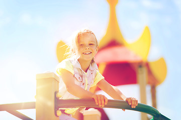 Image showing happy little girl climbing on children playground