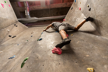 Image showing young man exercising at indoor climbing gym