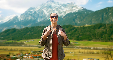 Image showing happy woman with backpack traveling in highlands