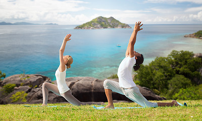 Image showing couple making yoga in low lunge pose outdoors