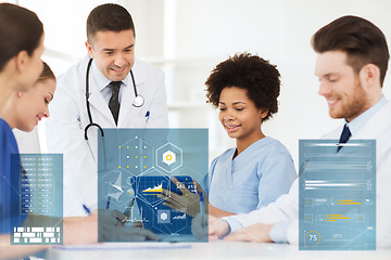 Image showing group of happy doctors with tablet pc at hospital