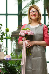 Image showing Girl with bouquet in shop