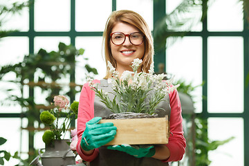 Image showing Smiling model with flower box