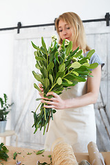 Image showing Florist with bouquet at work