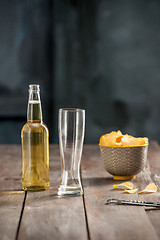 Image showing Beer glass and potato chips, pistachios isolated on a white