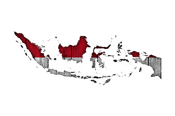 Image showing Map and flag of Indonesia on weathered wood