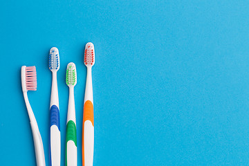 Image showing Colorful toothbrushes, space for text