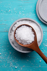 Image showing sea salt in stone bowl and wooden spoon