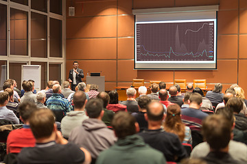 Image showing Business speaker giving a talk at business conference event.