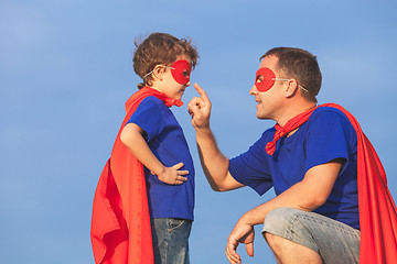 Image showing Father and son playing superhero at the day time.