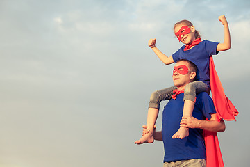 Image showing Father and daughter playing superhero at the day time.