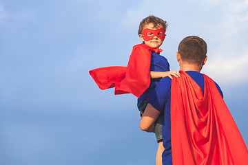 Image showing Father and son playing superhero at the day time.